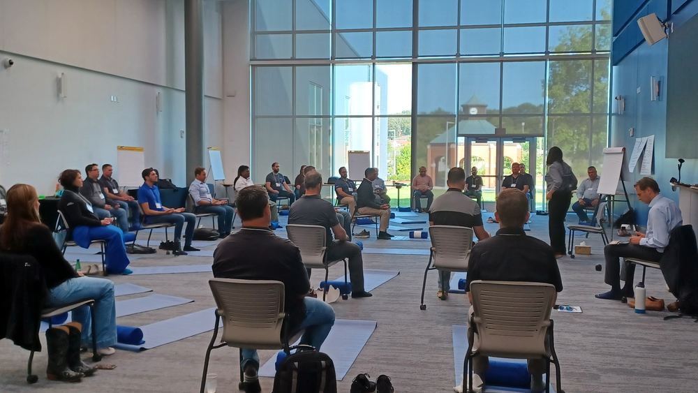 Leaders seated in a circle during a TLEX SKY Immersion Retreat