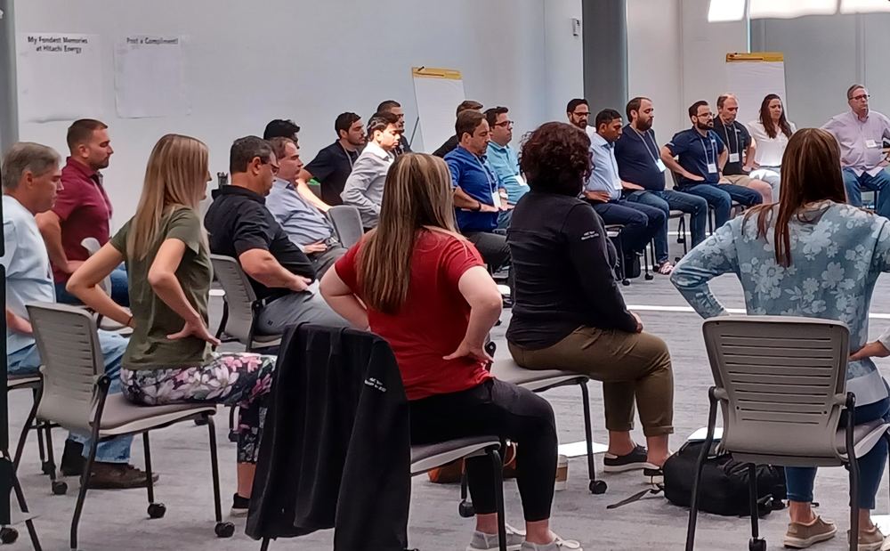 Participants seated in a circle during a guided practice