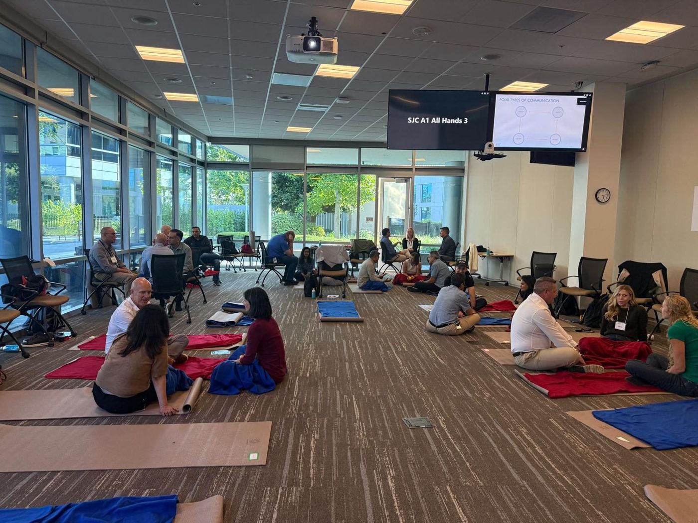 Participants seated on mats during a breathing practice